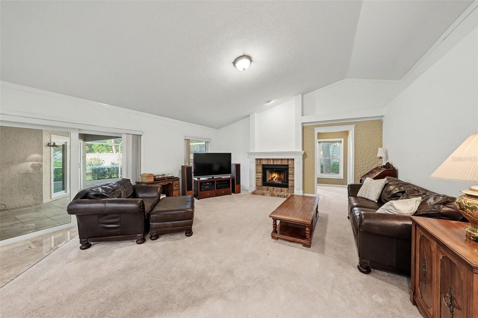 Family room is enormous and complimented with wood burning fireplace!