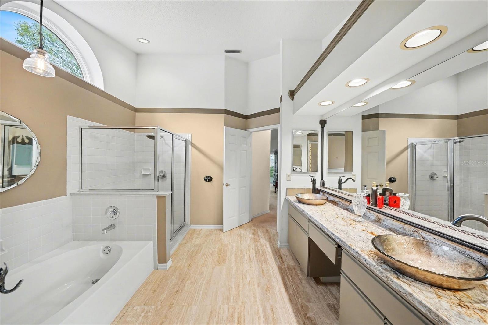 Beautiful update owners bath with expansive quartz counters