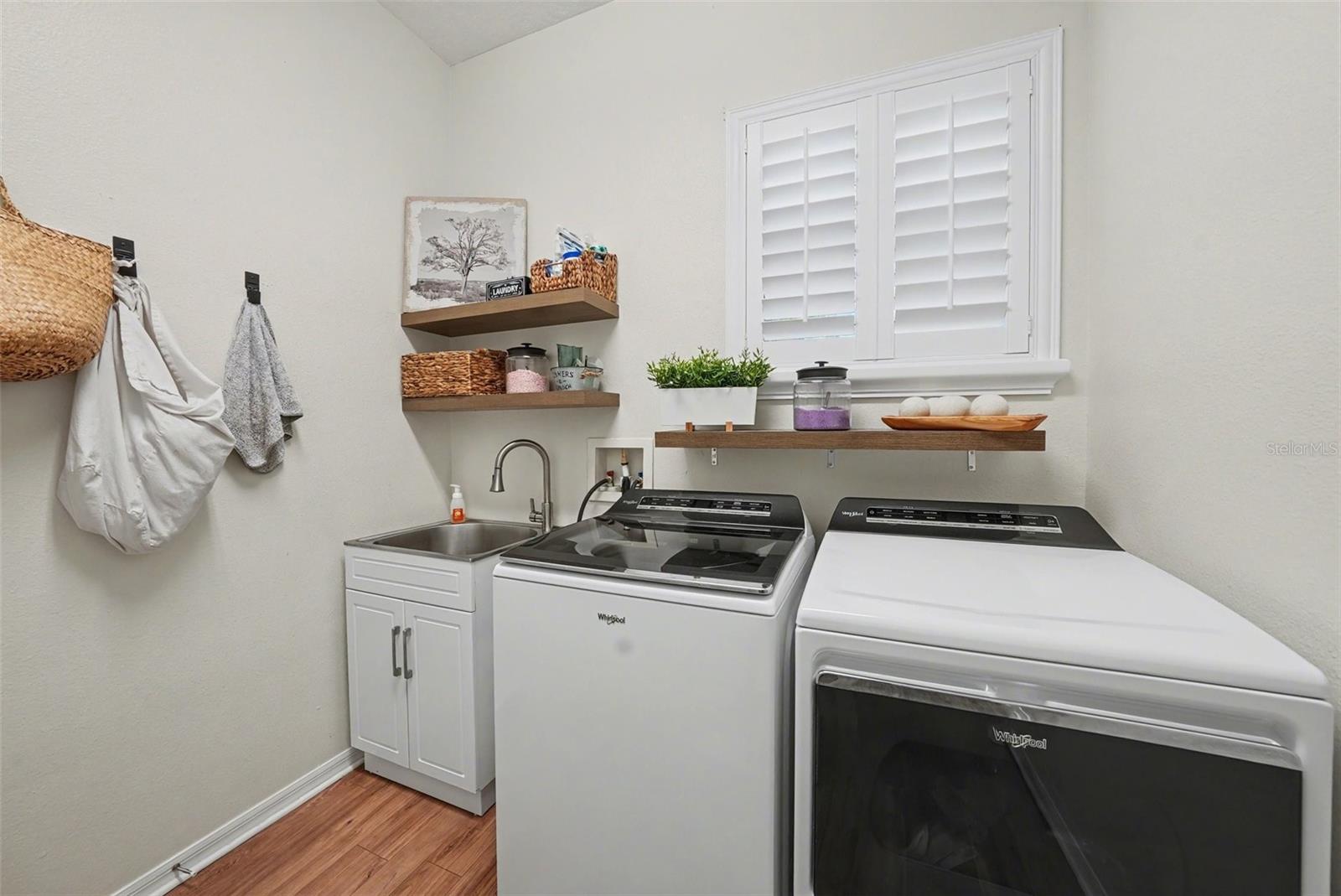 First floor laundry room with convenient access from the primary suite.