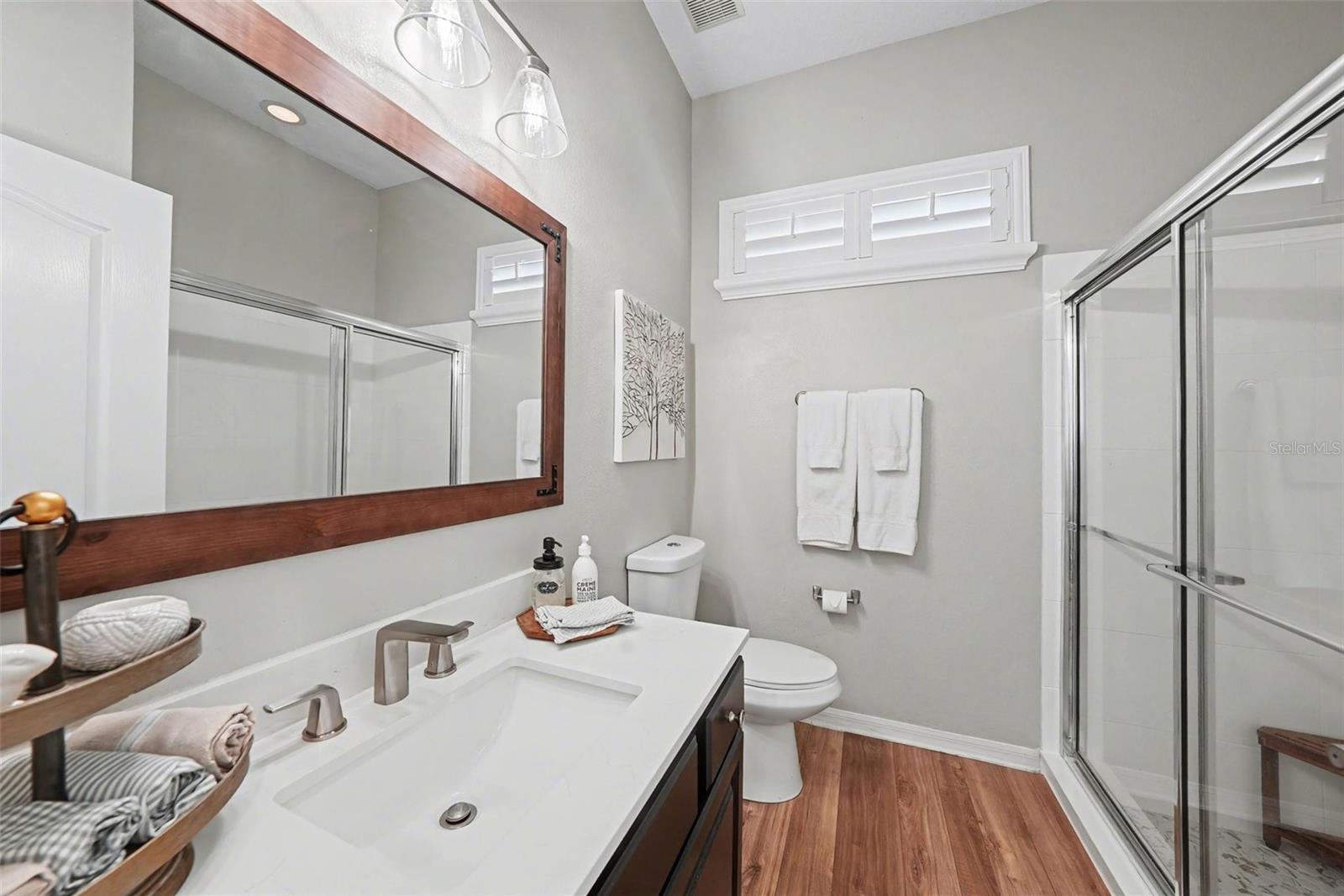 Full bathroom with easy access to the backyard and pool area.