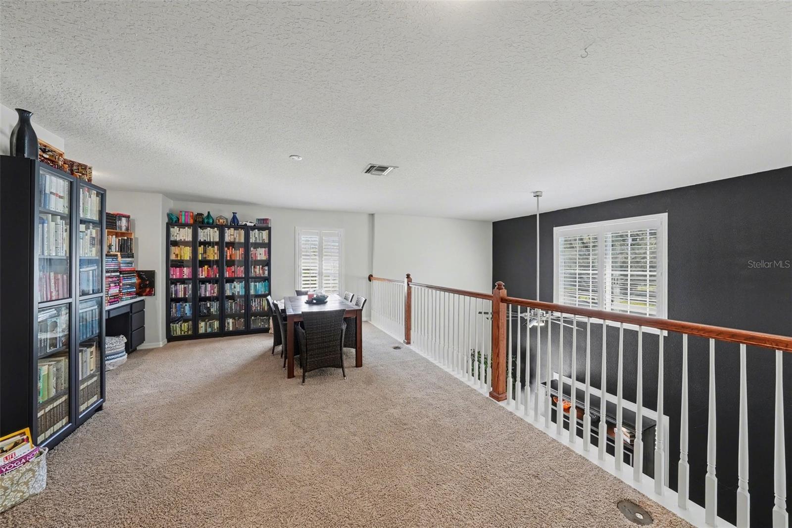 The loft upstairs offers an added flex space. A library, office, game room, pool table room, you name it.