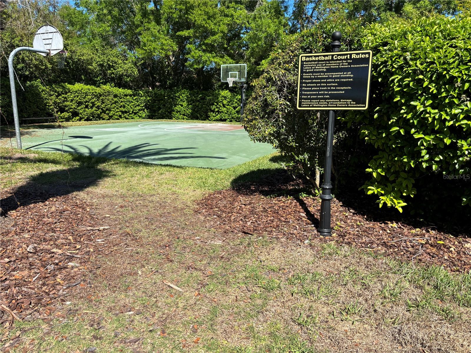 Basketball courts located between play ground and tennis courts.