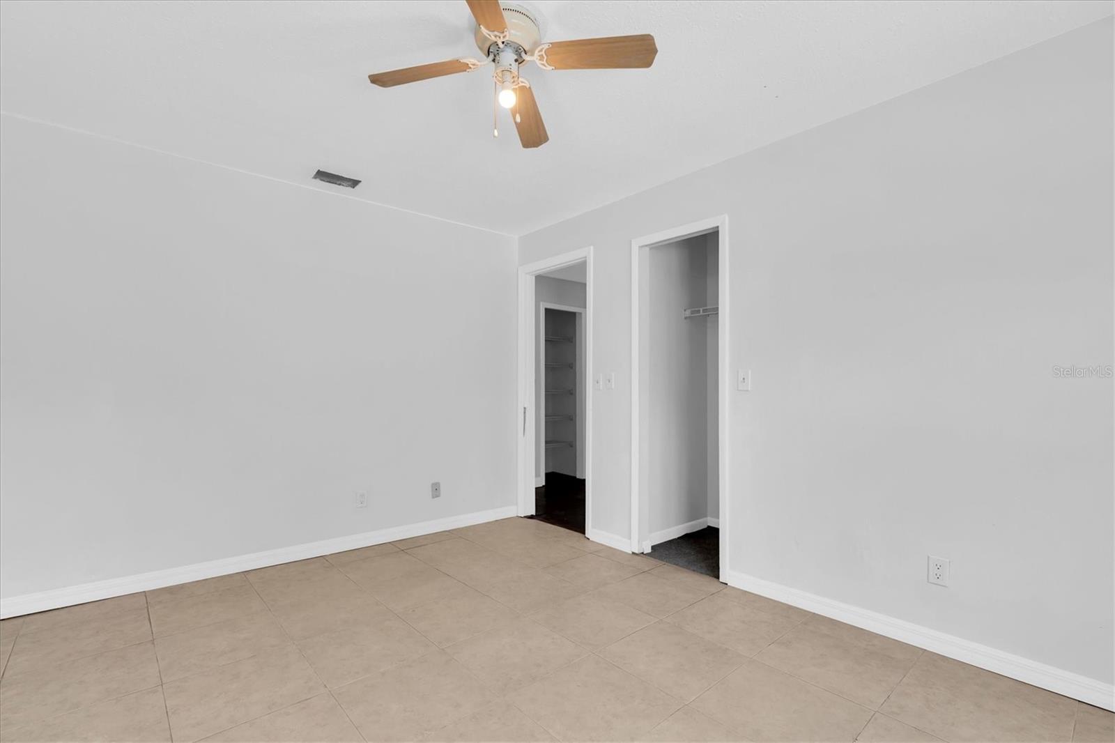 Bedroom 2 with view of closet and hallway toward bathroom