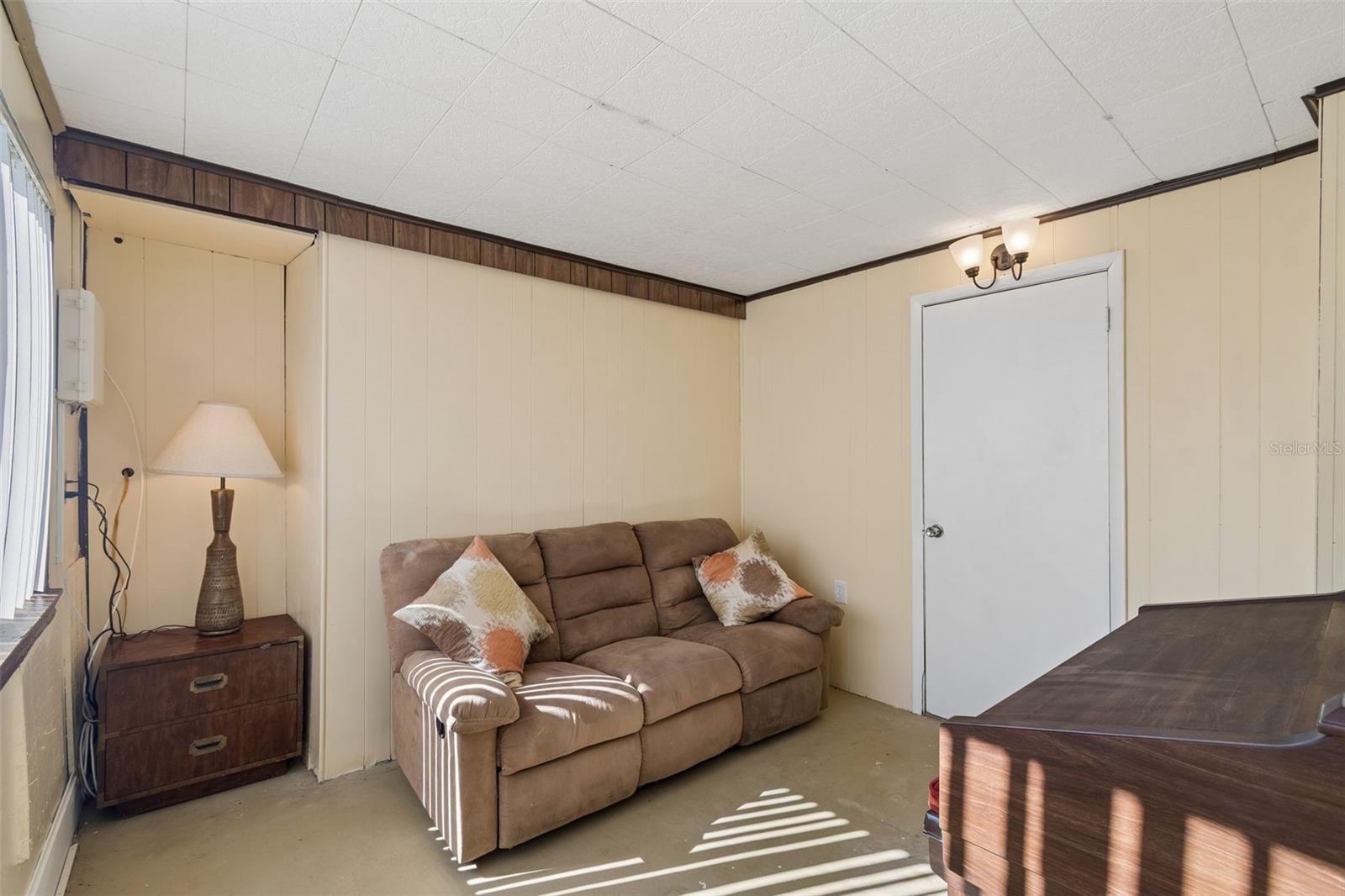 Mud Room leading into Garage NO AC