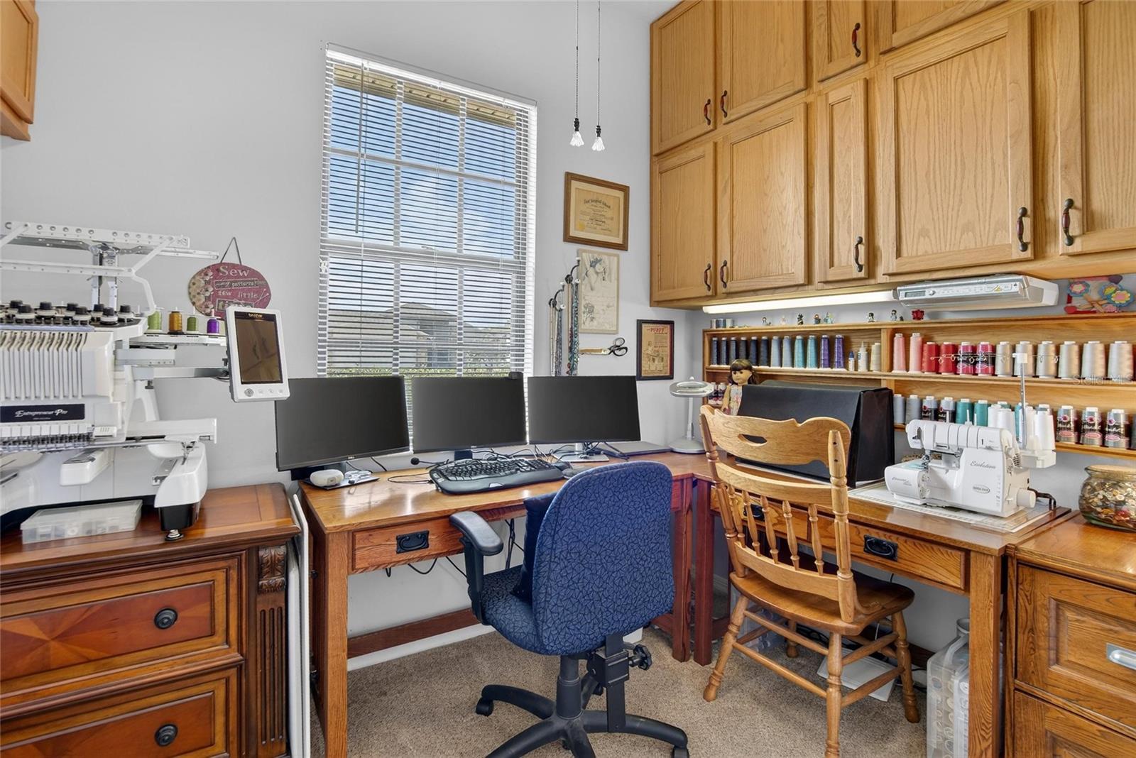 Owner walkin closet currently used as an office/craft room.  Can be converted back with addition of clothing poles.