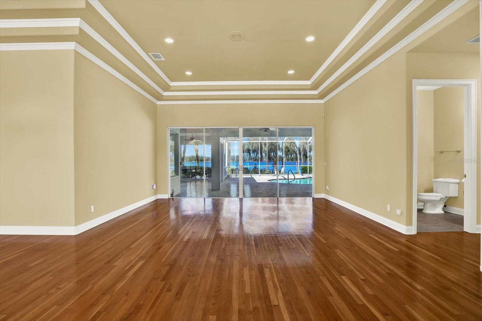 Enjoy views of the pool and lake immediately upon entering the home.