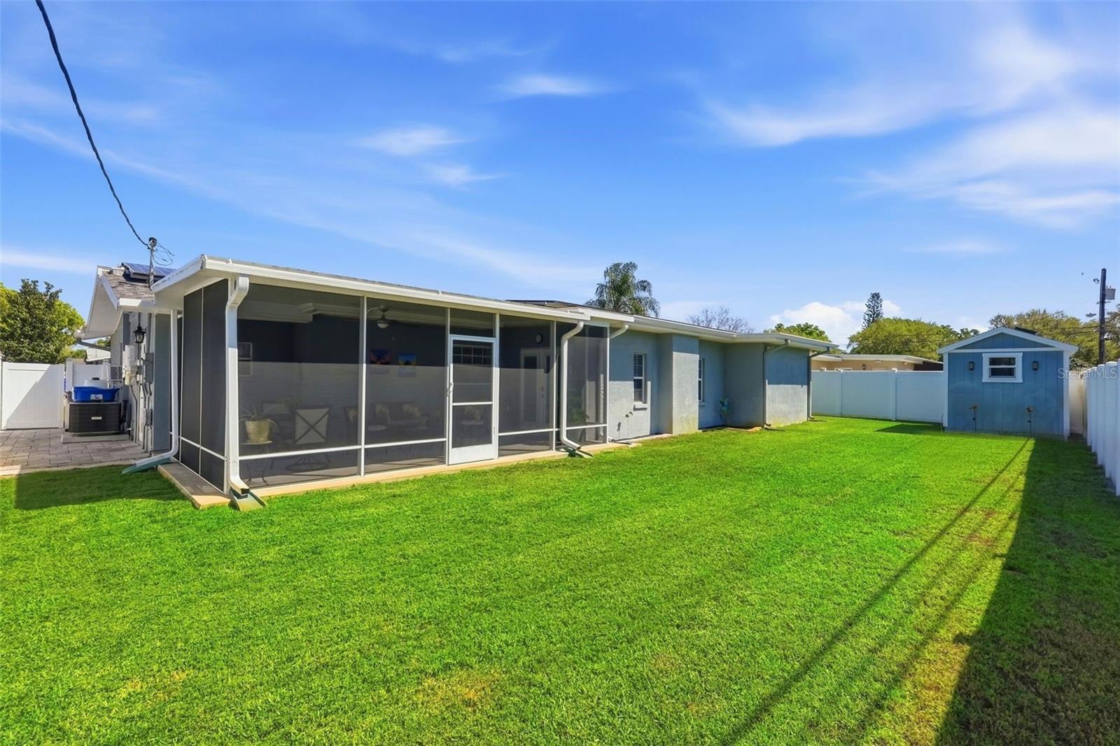 Fully fenced in backyard with pavers down the side. Plenty of space for a pool!