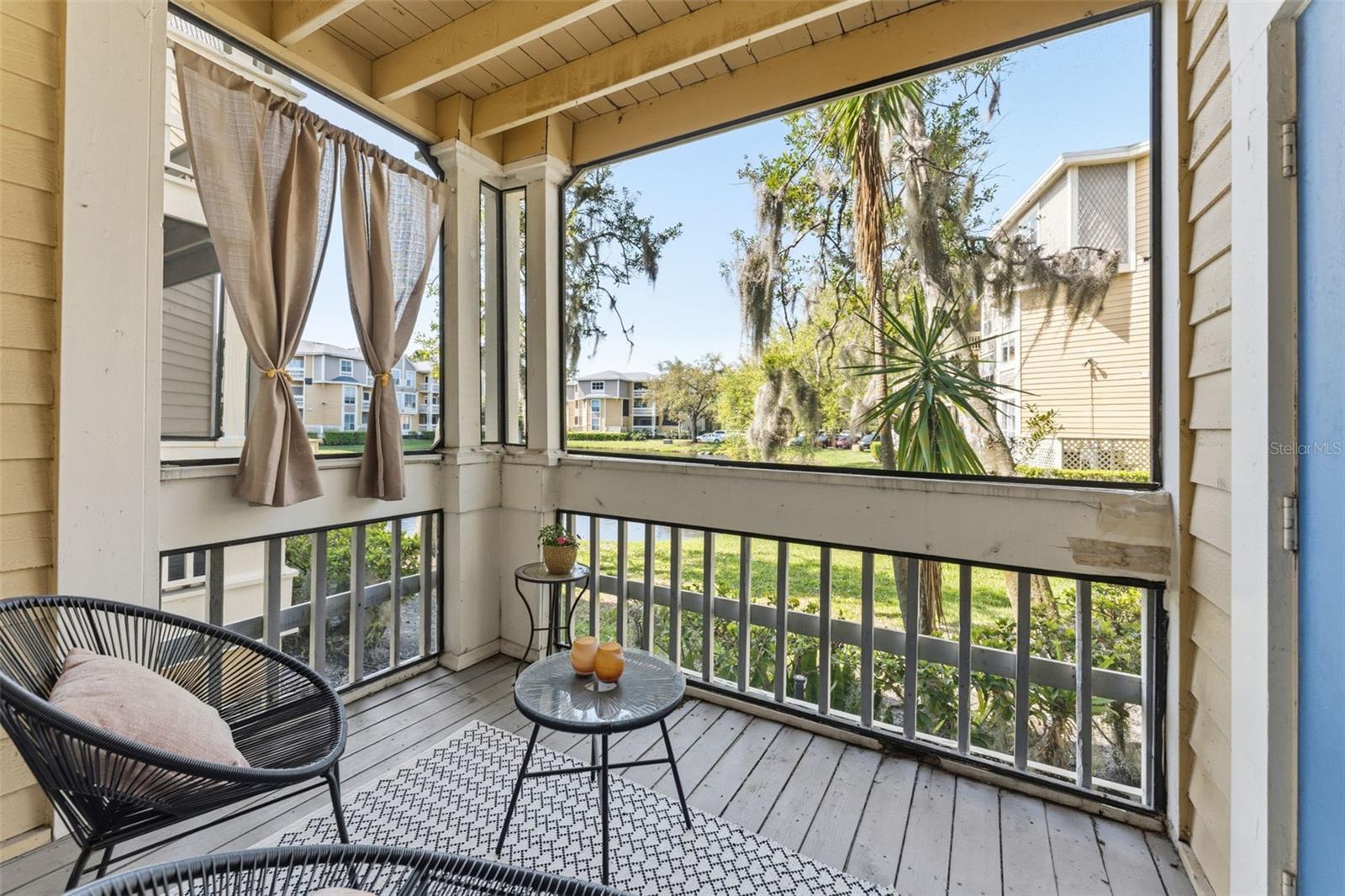 your peaceful screened in lanai looking with water views.