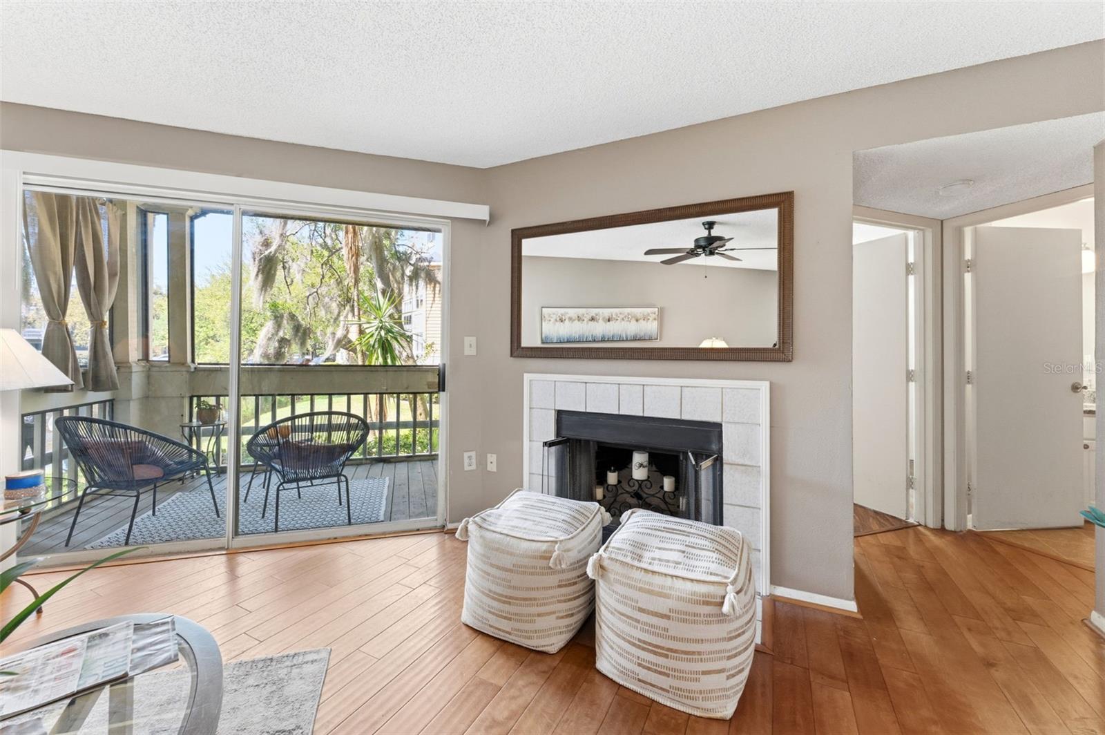 The wood burning fireplace enhances the living room- nice for those rare chilly nights!