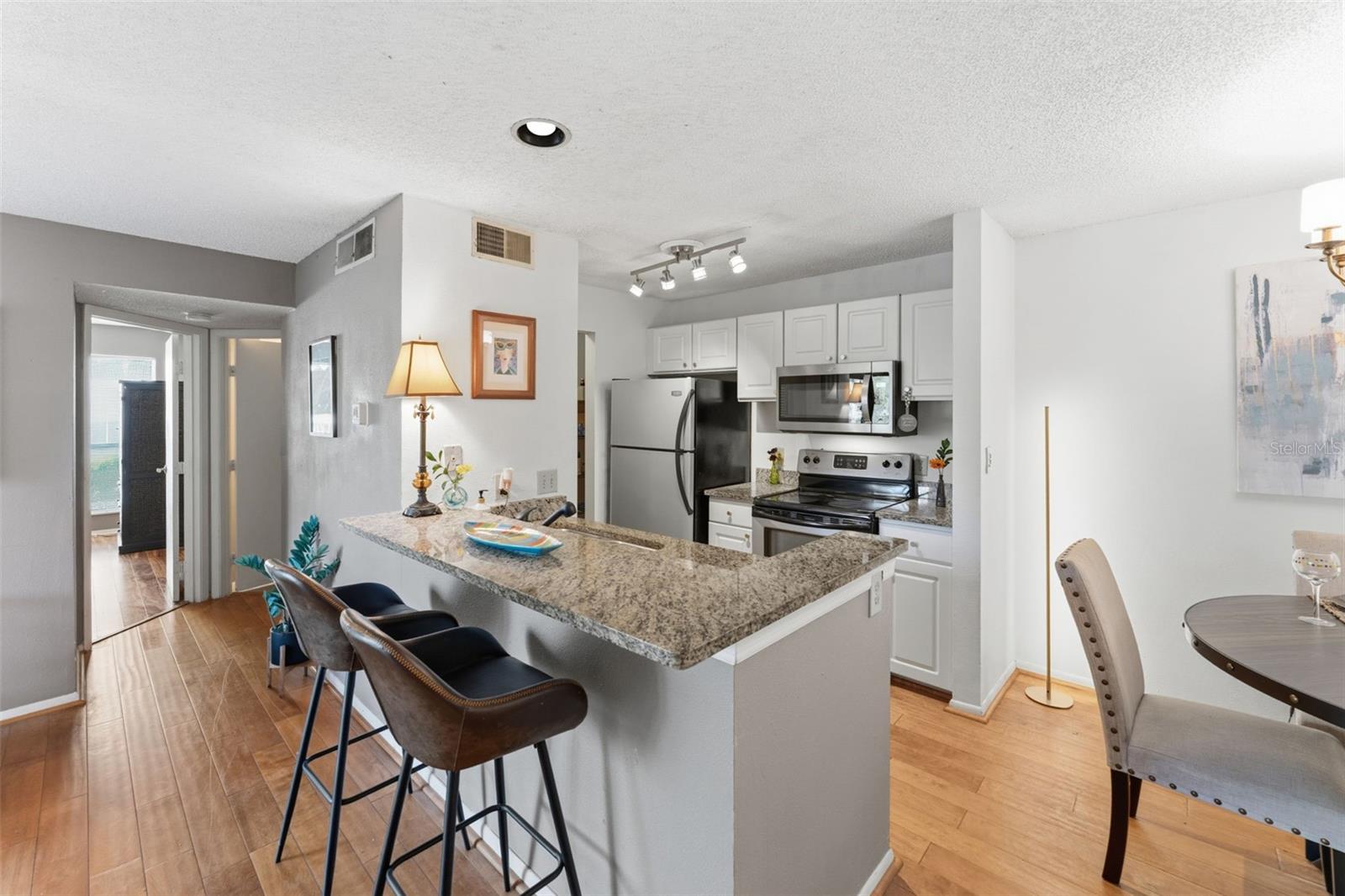 Check your emails at this delightful breakfast bar with granite countertops.