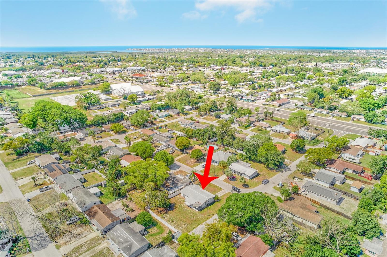 Aerial view of the neighborhood and home