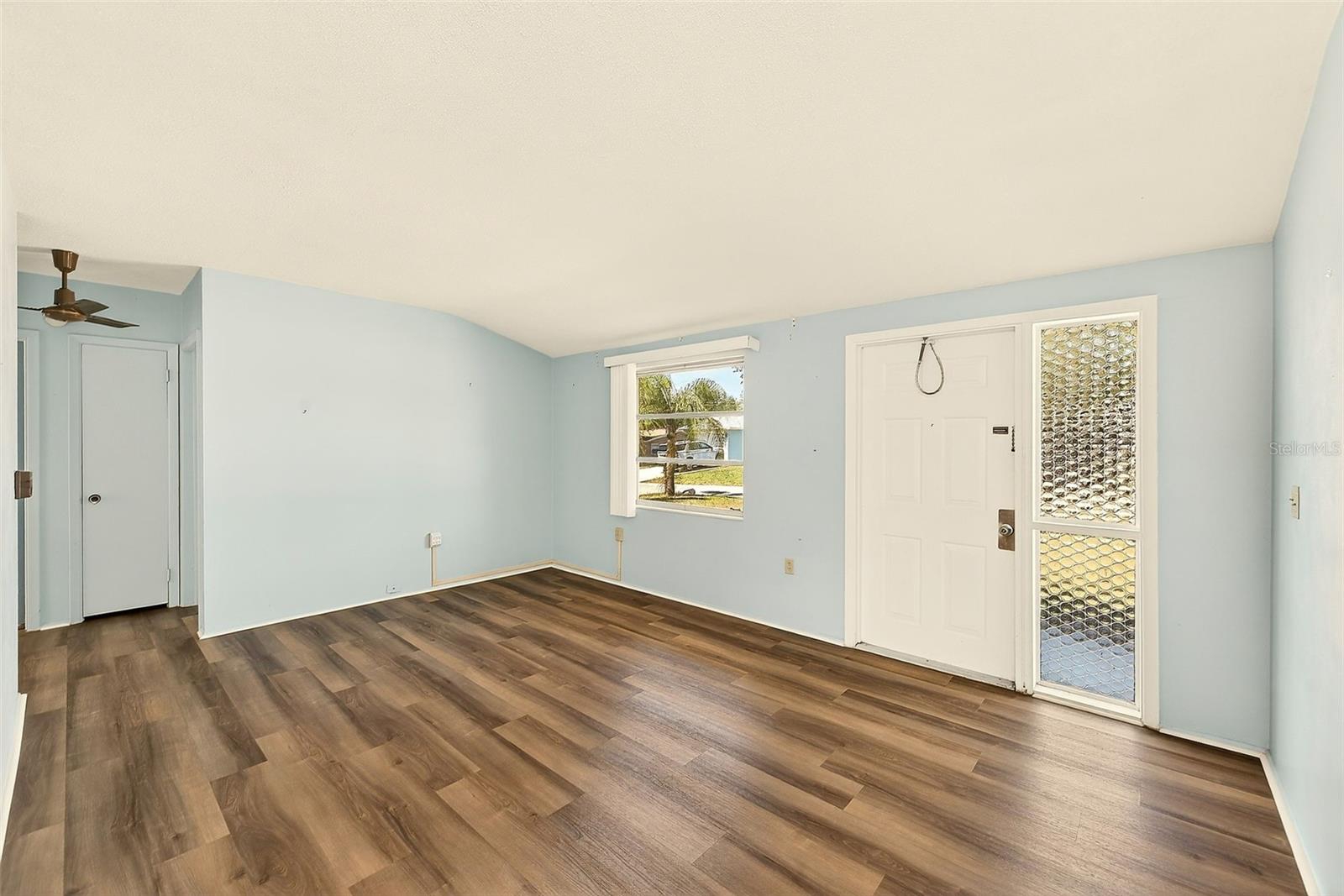 View of living room with high ceilings