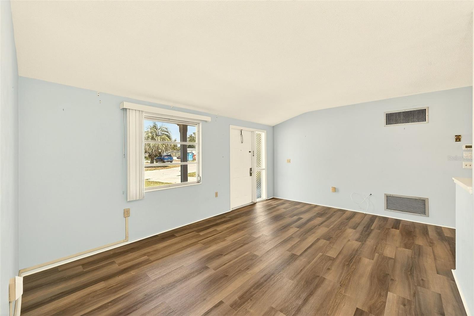 2nd view of living room with high ceilings