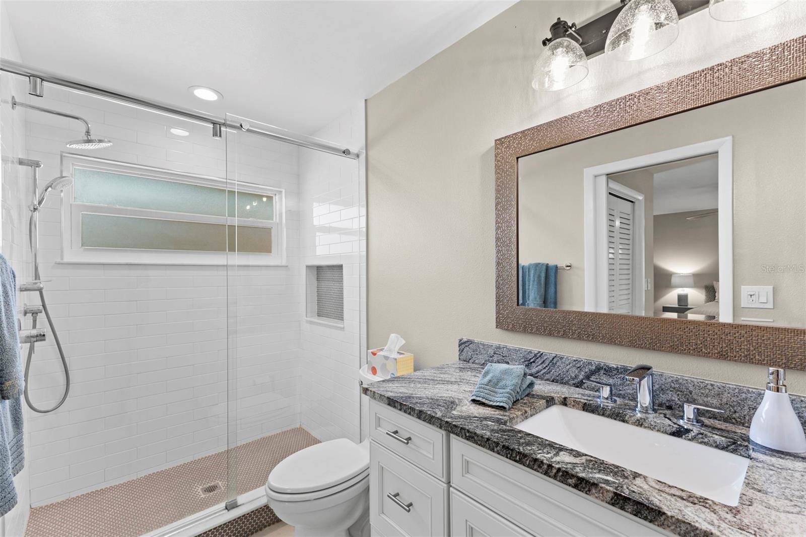 Updated ensuite bath with step-in shower