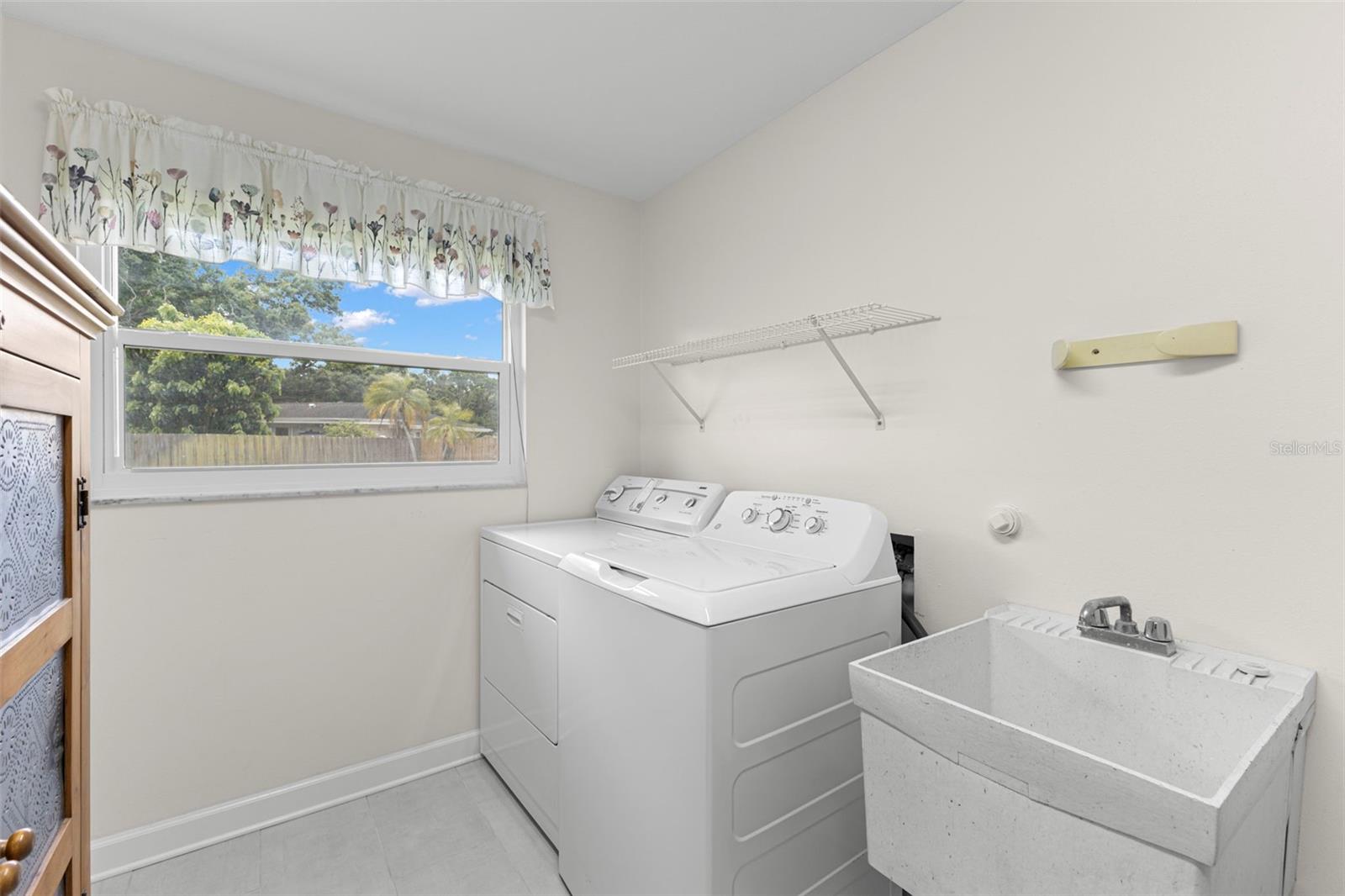 Laundry room with additional storage