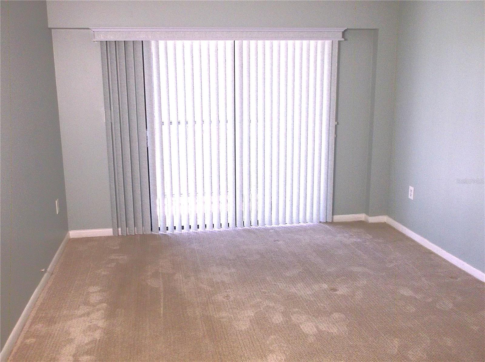 Walk out sliders from bedroom to balcony