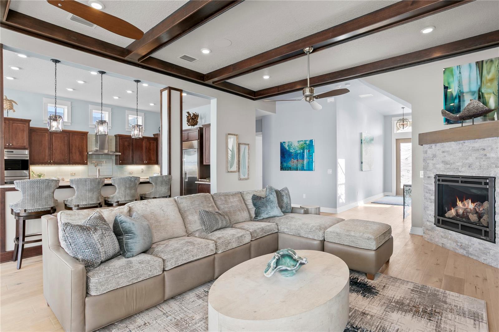 A cozy fireplace sets the tone for snuggling in for a movie night after enjoying a day on the beach.