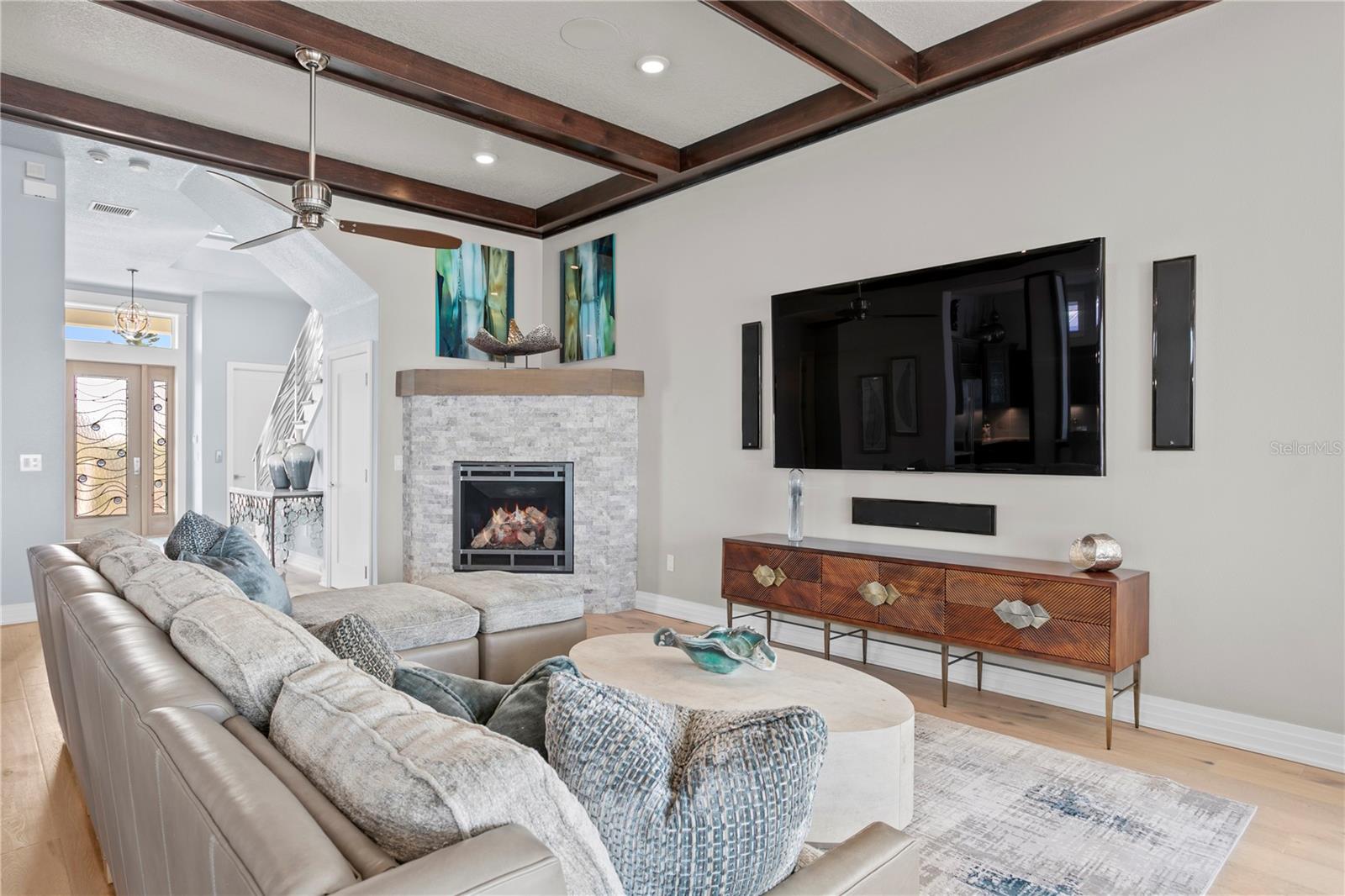 Movie nights will never be the same with this 98" wall mounted television with Atmos surround sound (similar to an Imax theatre)