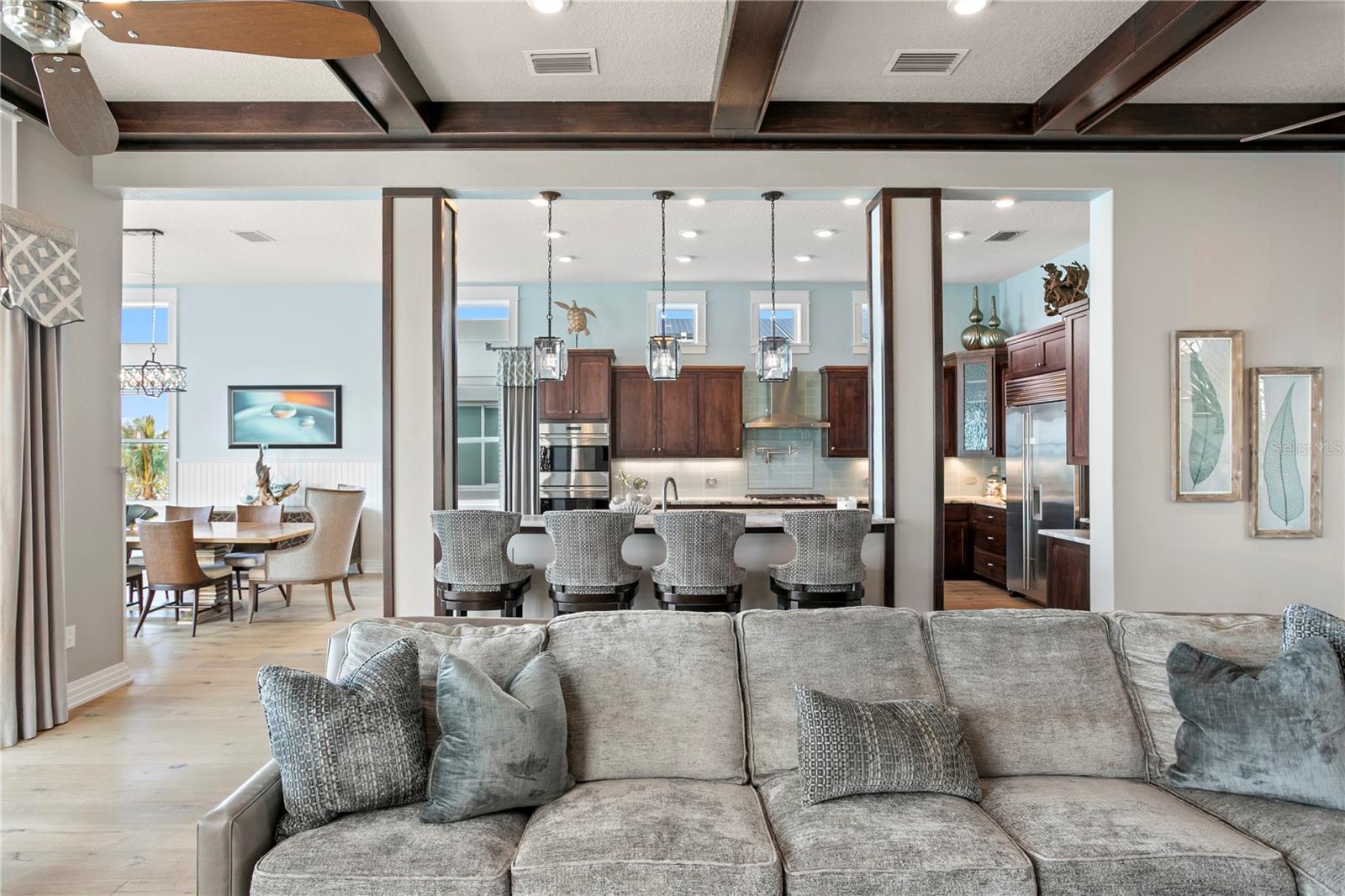 11' Ceilings with custom beam work in family living space.