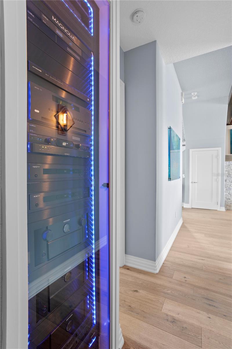 Savant-powered rack delivering whole-home control of audio, video, lighting, and electronic blinds.