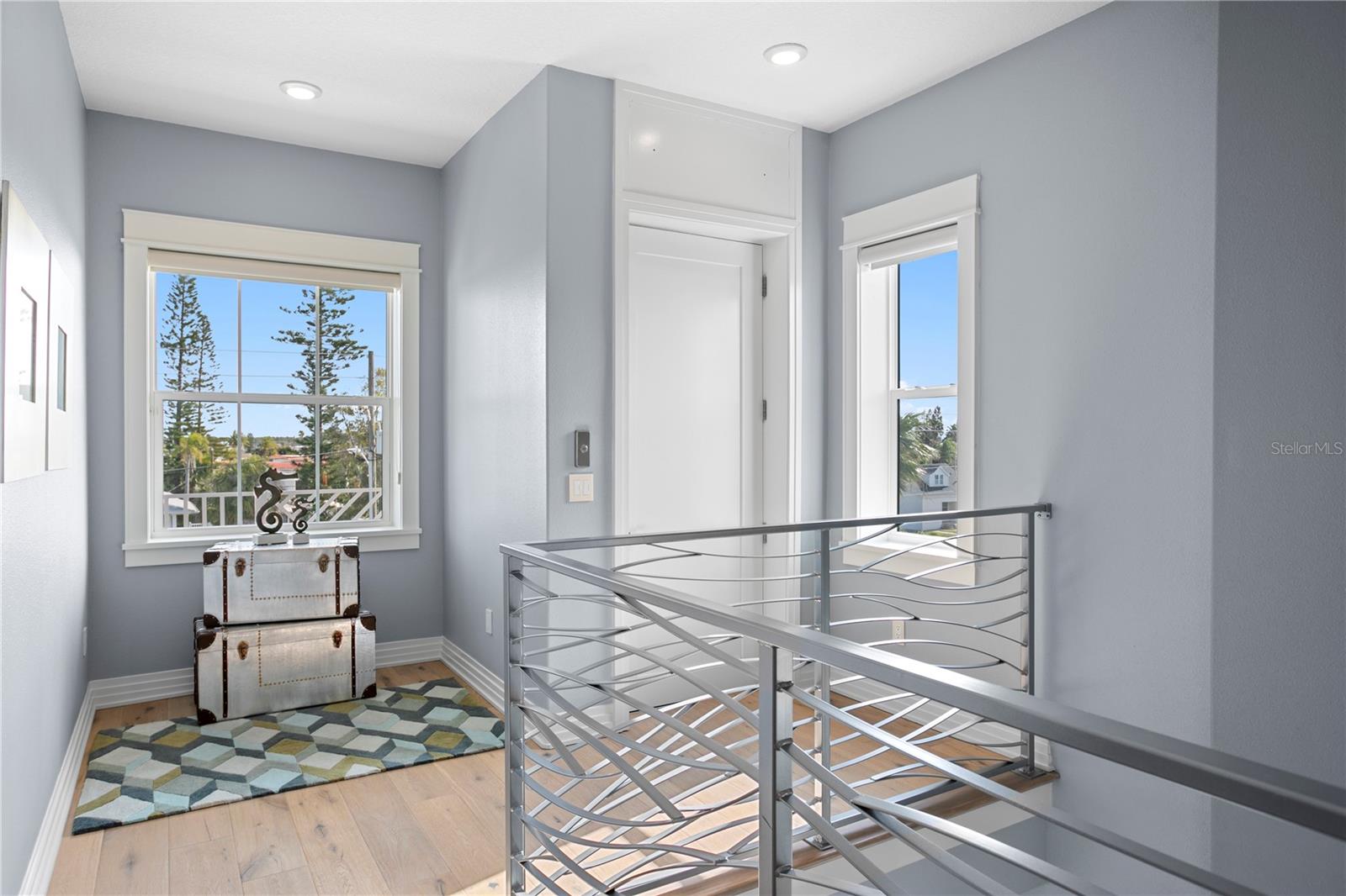 Guest Suite 2 on the 2nd level enjoys loads of natural light with a private balcony, an en suite bath and walk in closet