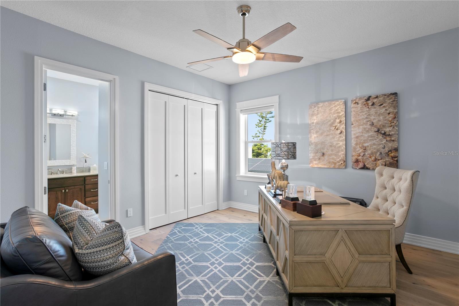 Bedroom 4, currently used as an office, enjoys an en suite bath with tub