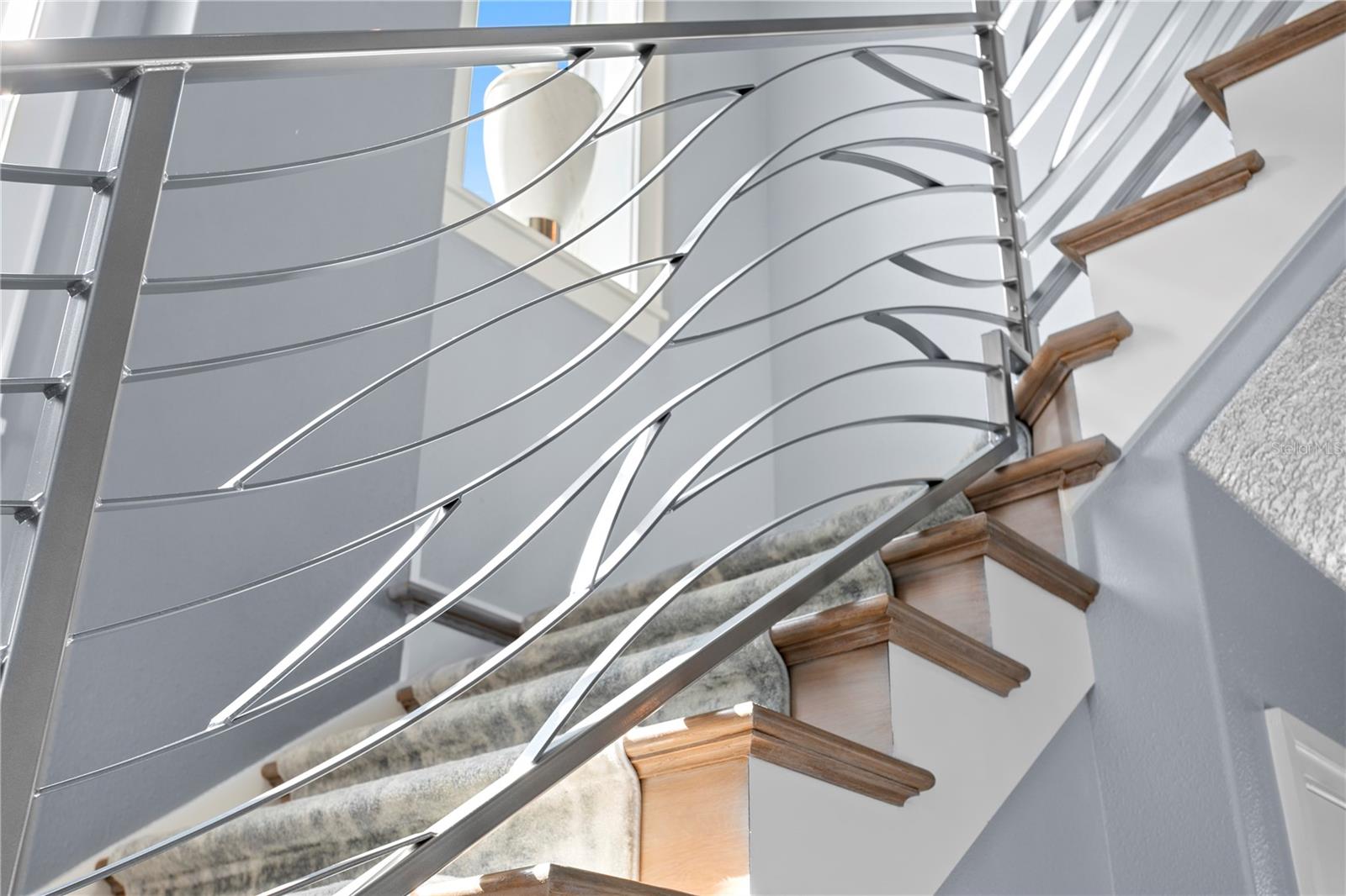 Owner curated custom railings to emulate waves from the Gulf