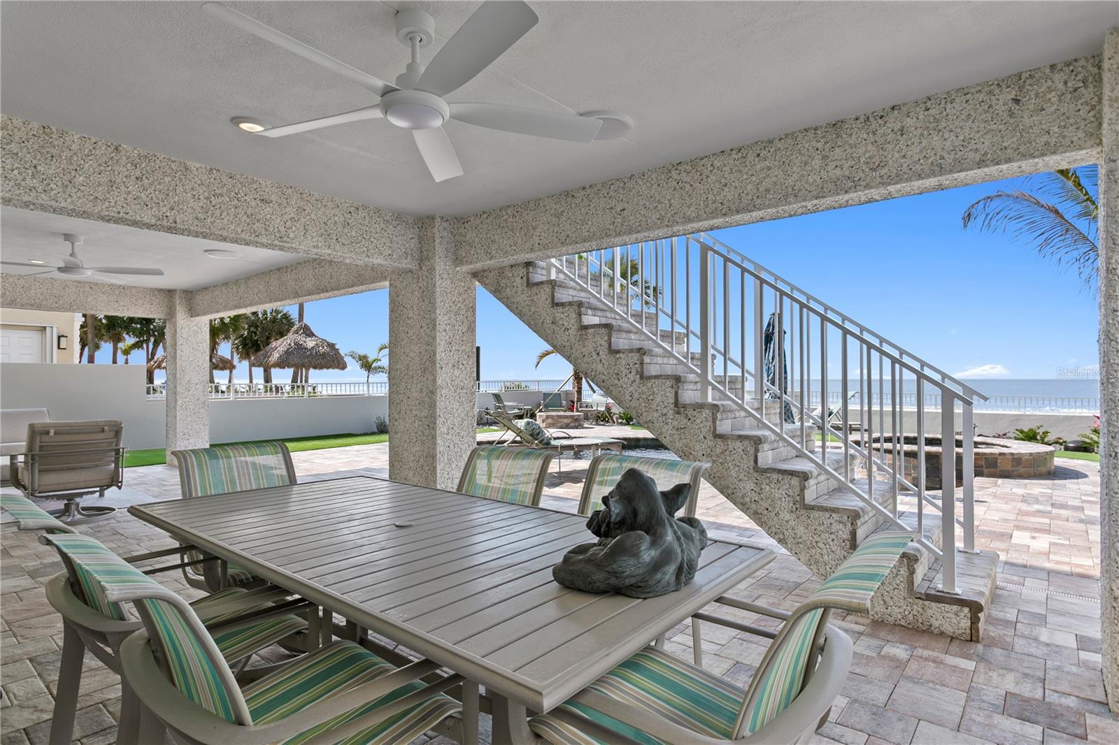 Escape from the pool and sun to this wonderful covered ground level space