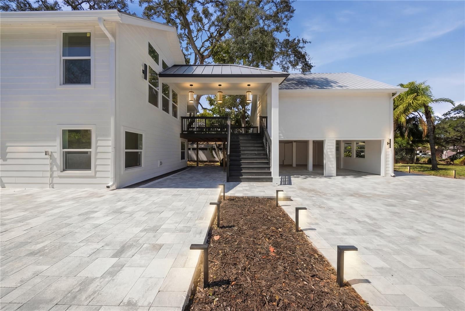 Staged with covered walkway between buildings.