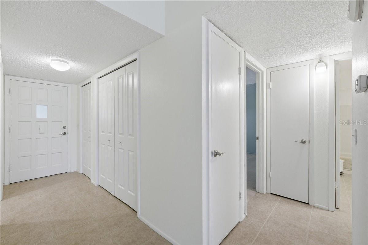 Front door and hallway to bedrooms