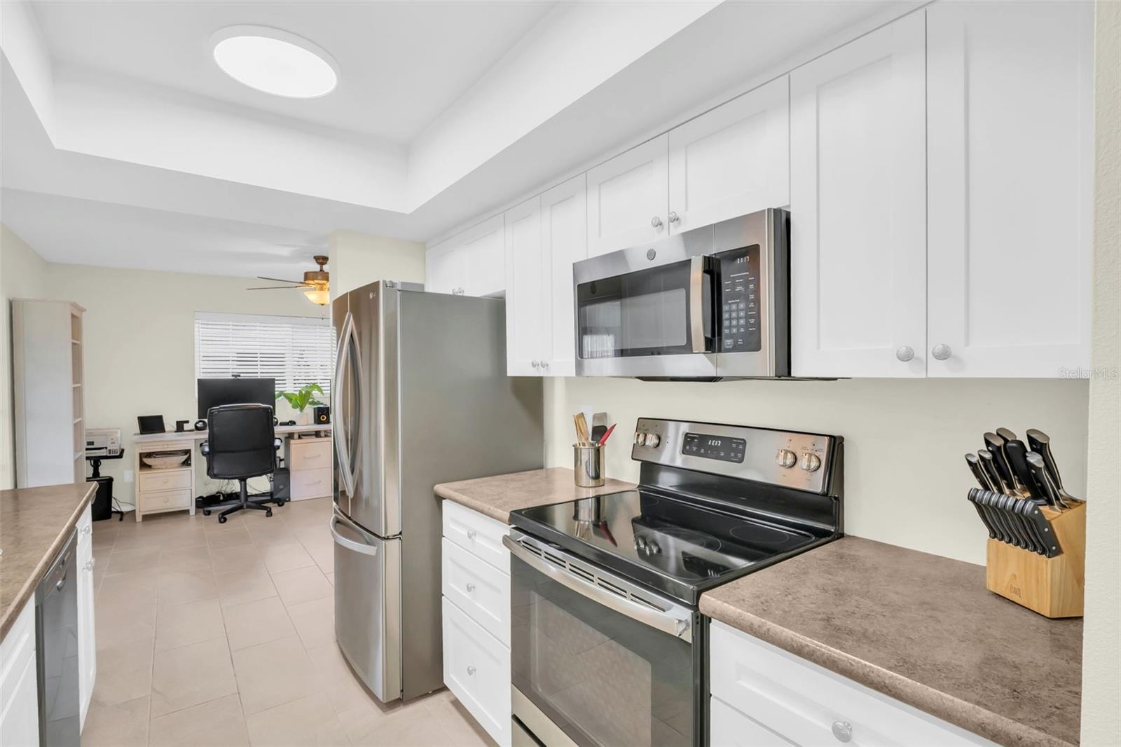 Stainless steel appliances and plenty of storage & counter space~