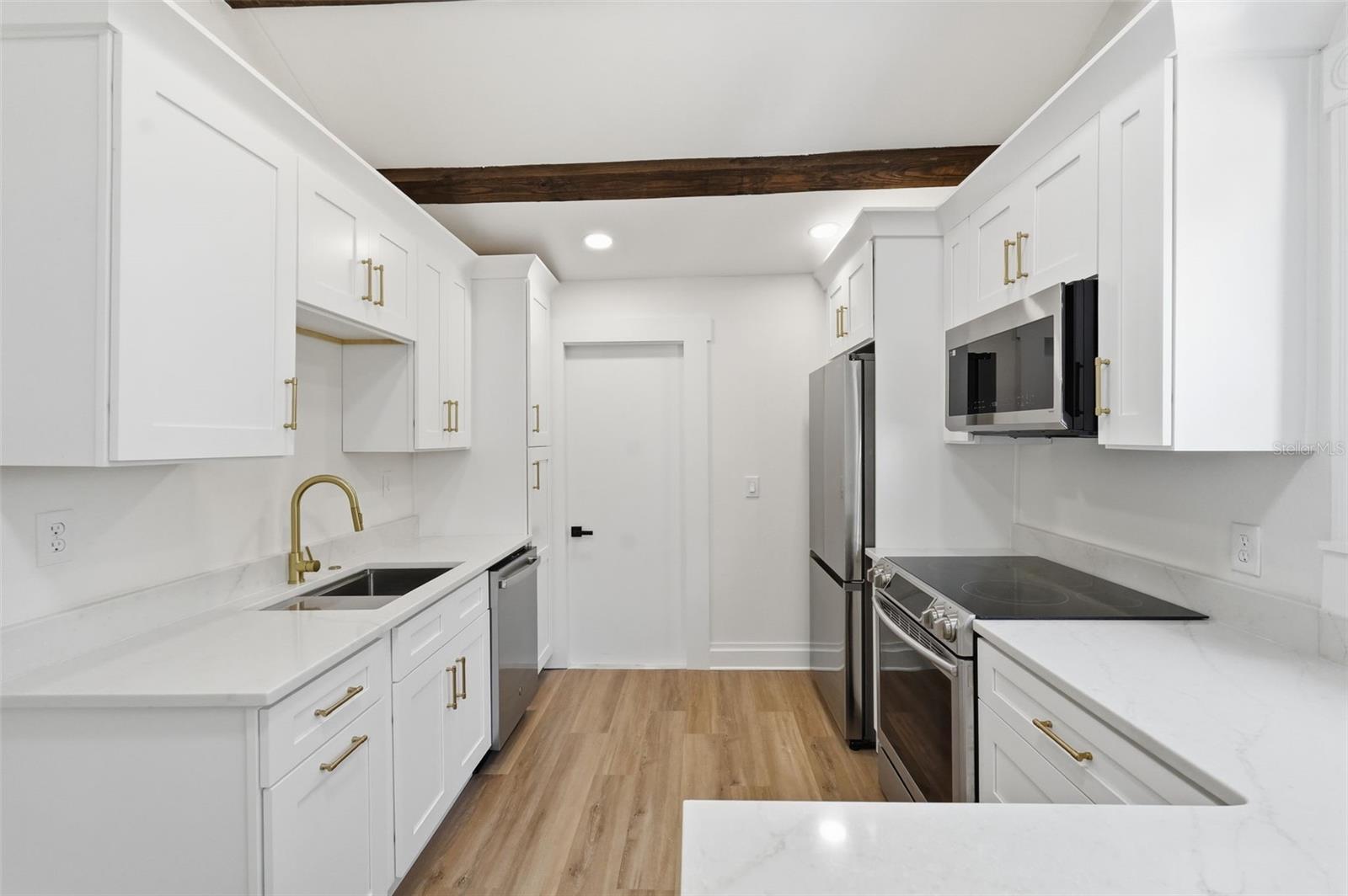 Kitchen. The door leads to side Porch