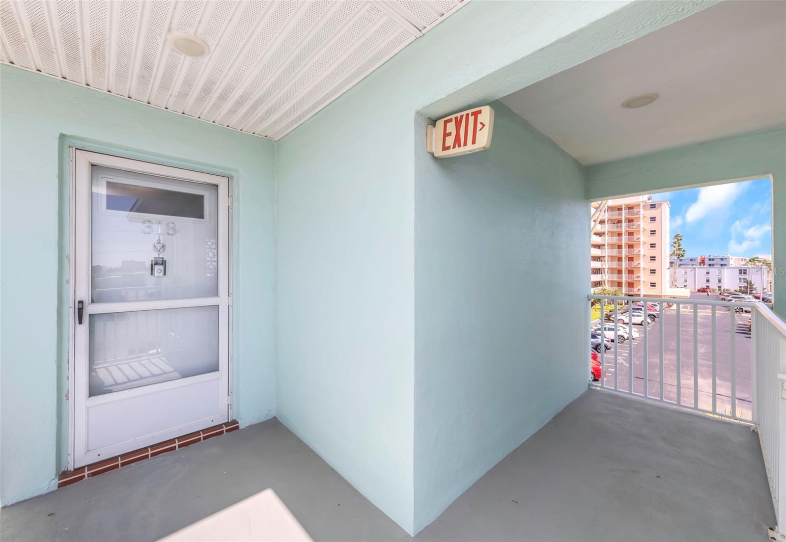 Front door to#318 with stairs steps away.