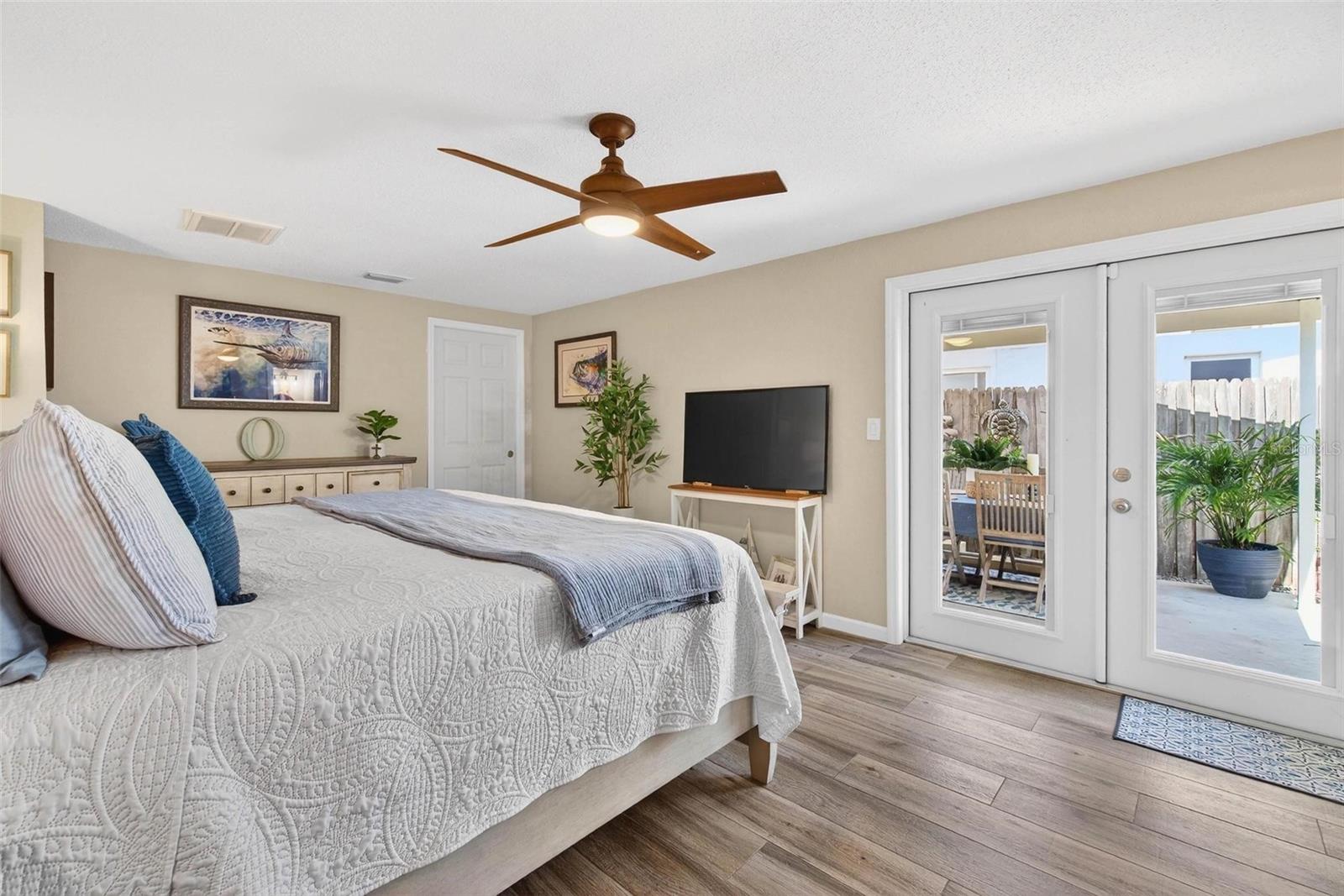 French Doors to covered patio from the primary bedroom
