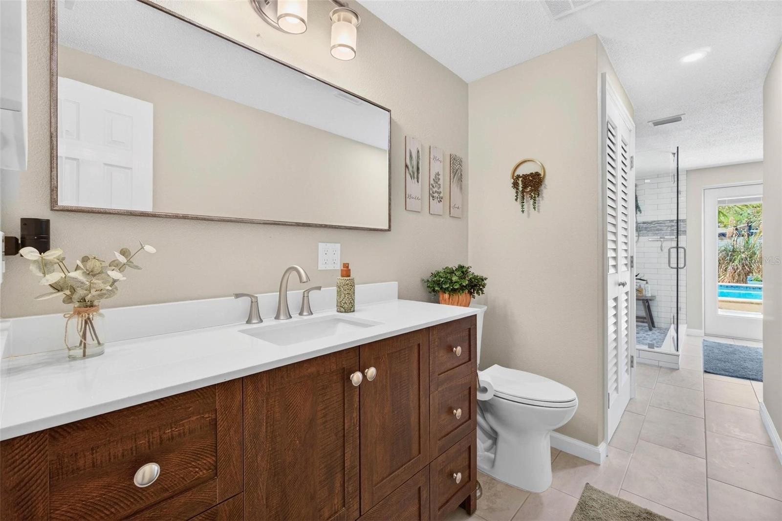 2nd Bathroom with exit door to the pool