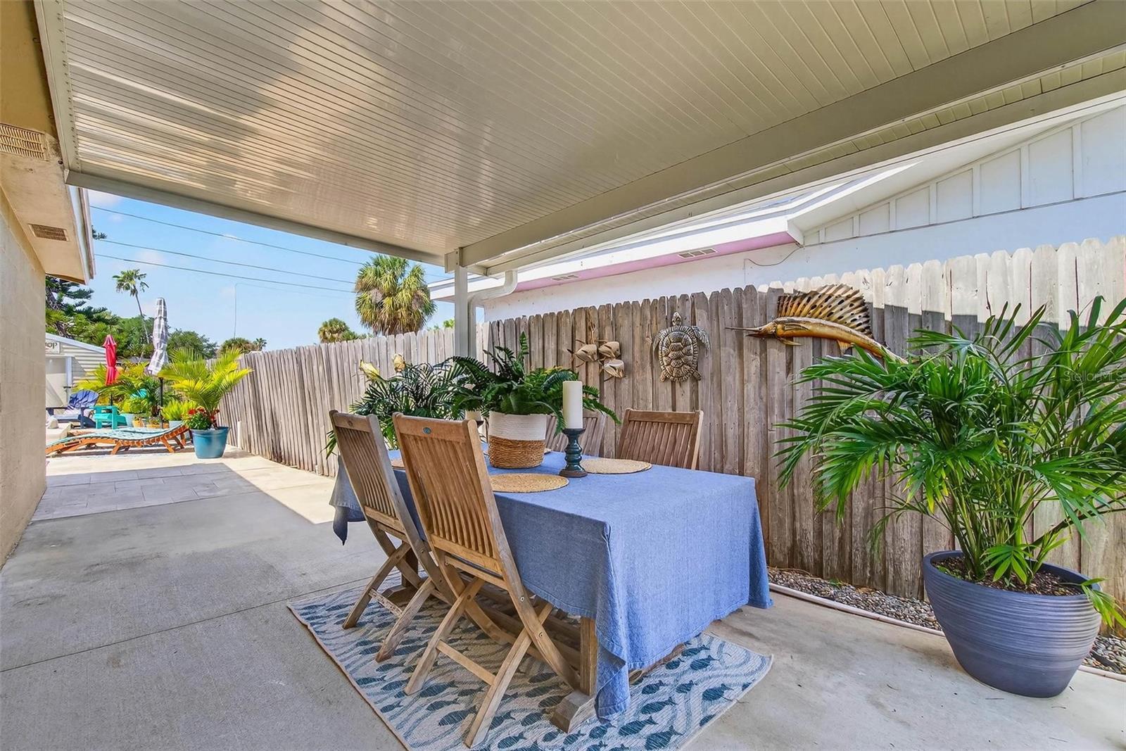 Covered Patio off the primary bedroom leading to the pool area