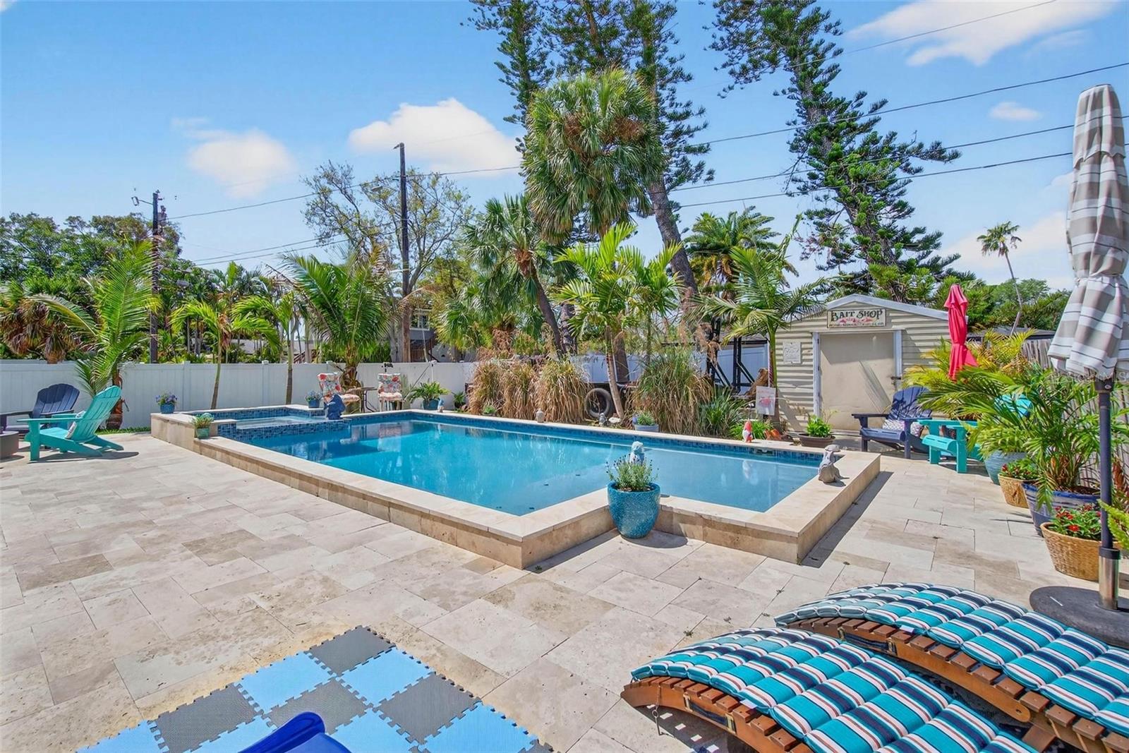 Large 2nd Driveway for a Boat or RV storage behind the Pool with a Double Gate entrance.