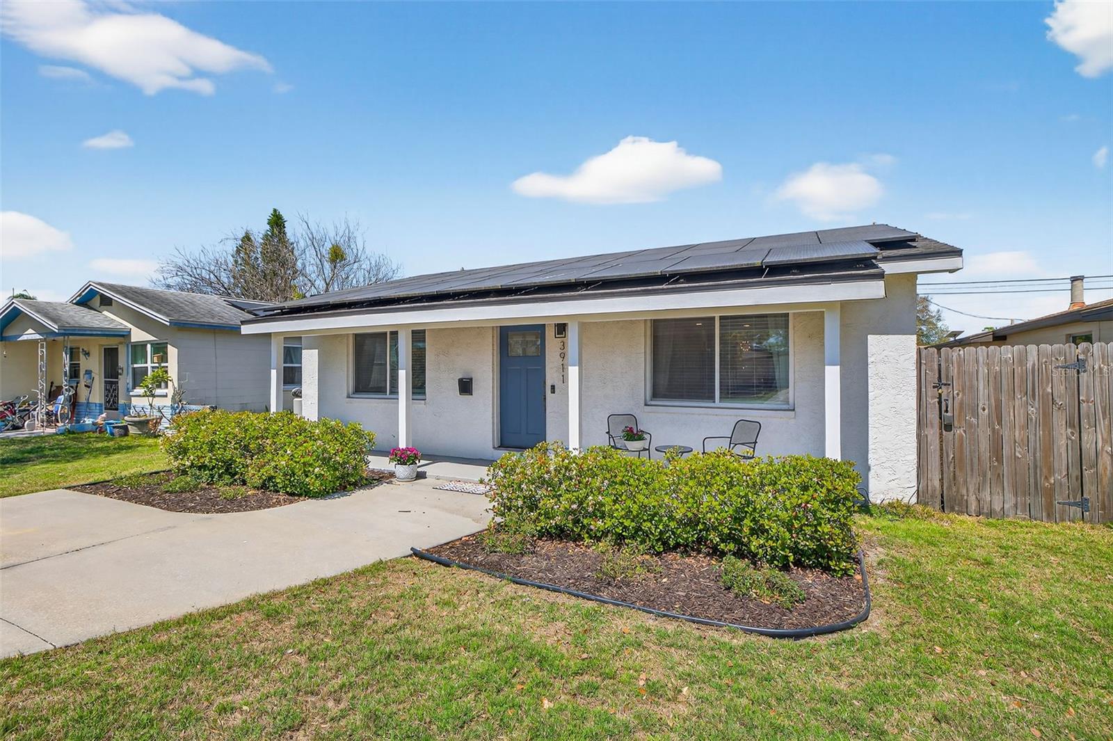 Welcoming front porch, and energy-efficient solar panels
