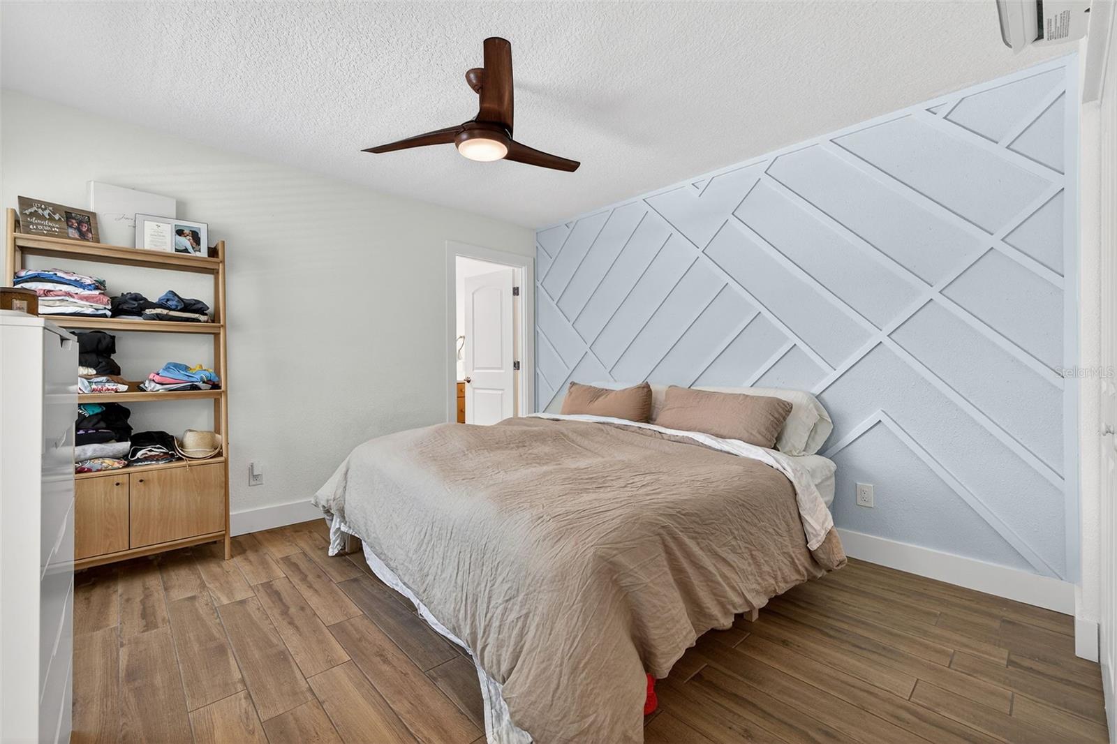 Custom woodworking for a beautiful accent wall in the master bedroom