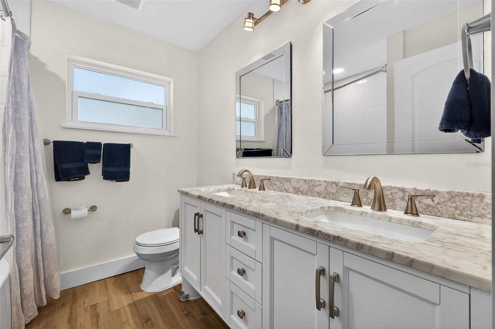 Guest bathroom has double vanity