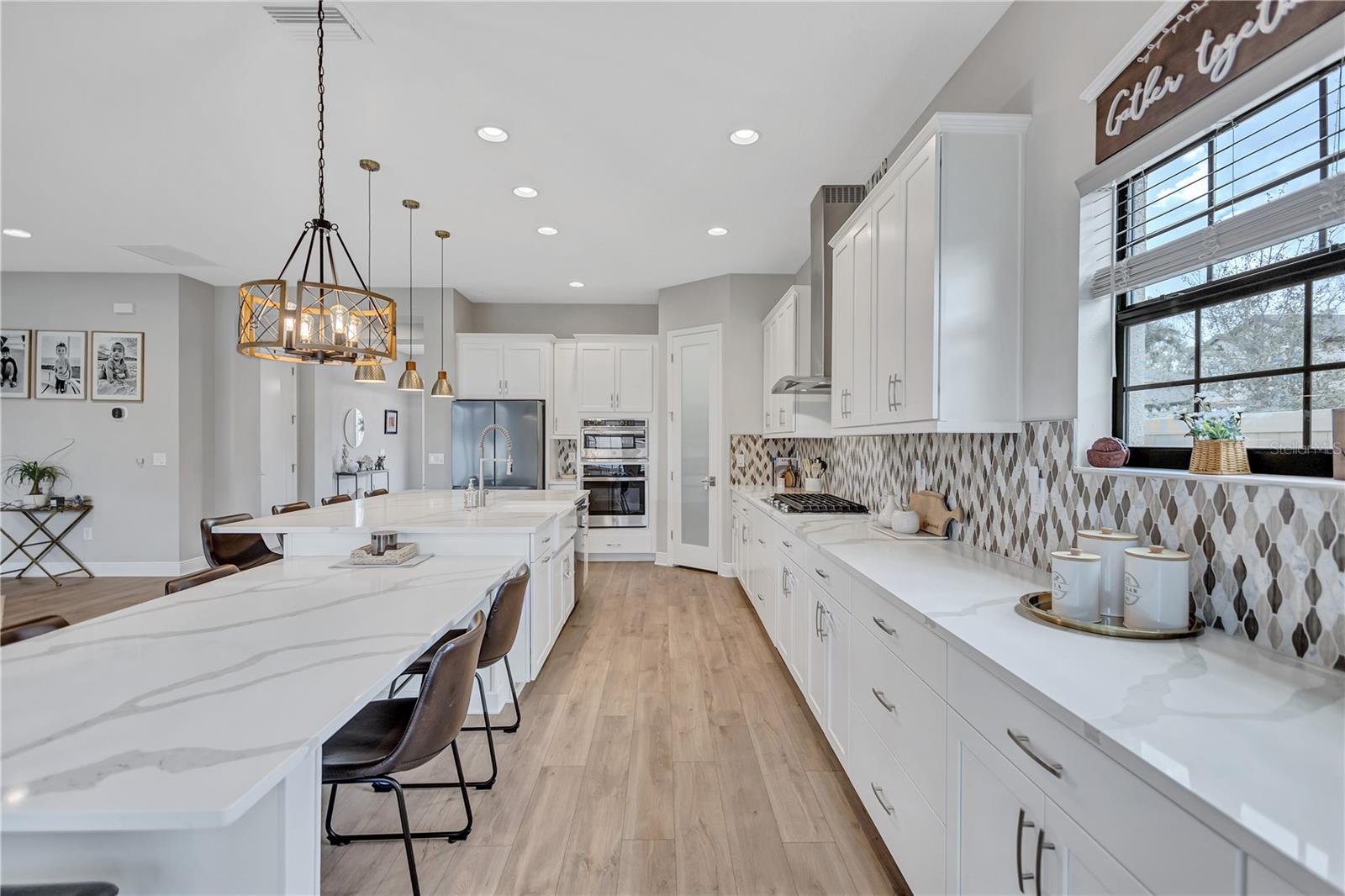 Sonoma Linen cabinets, Calacatta Novello Quartz counter-tops, Floorte Pride Plus Riverside LVP