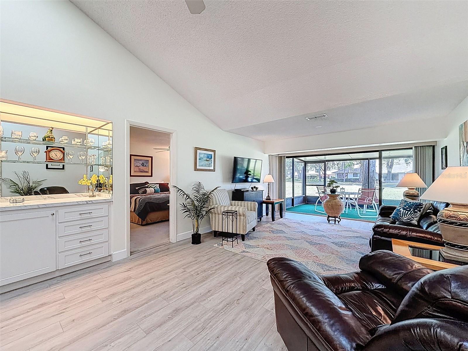 Living room with built in bar.