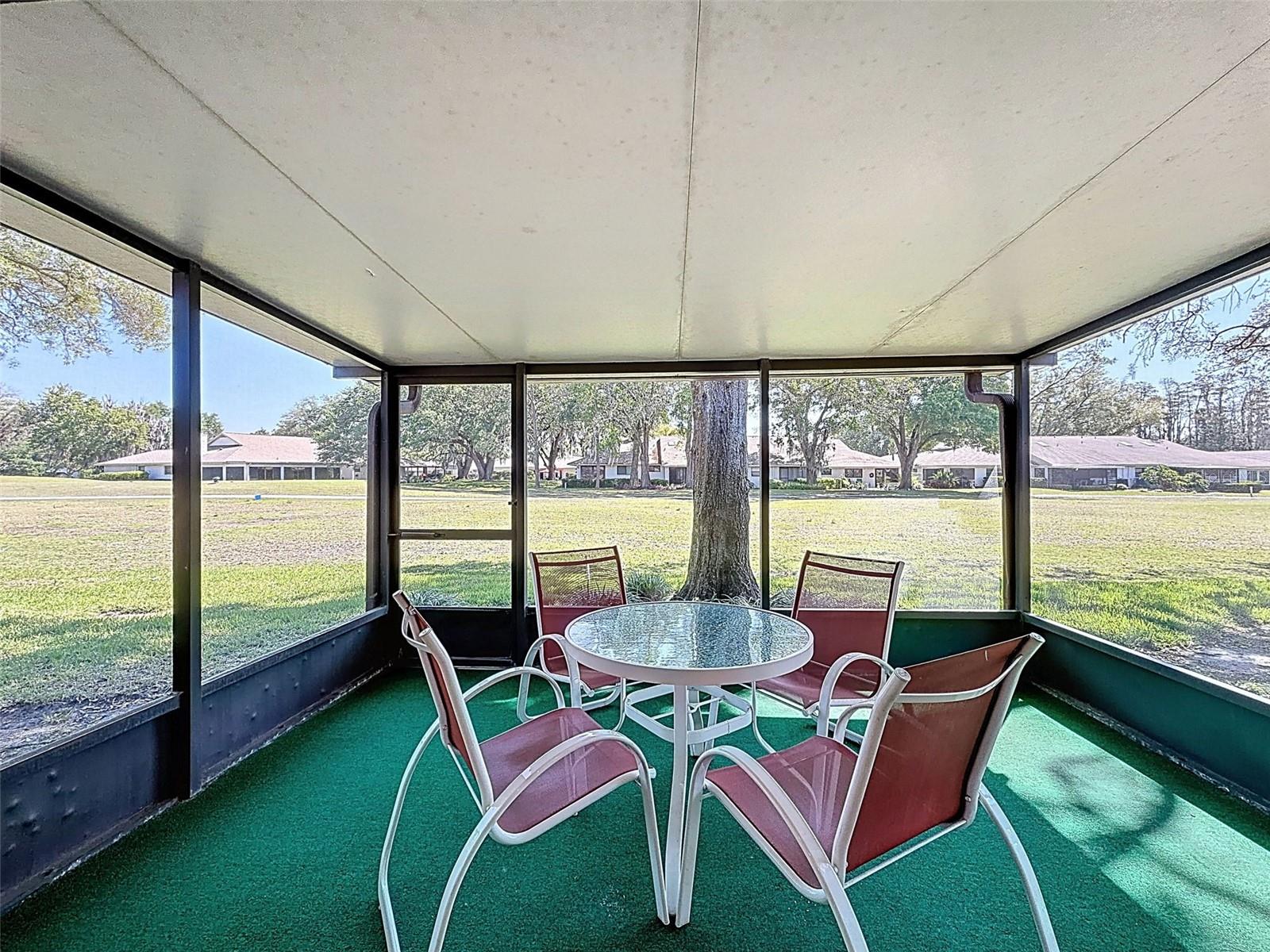 open the wall of sliders to your freshly screened lanai.