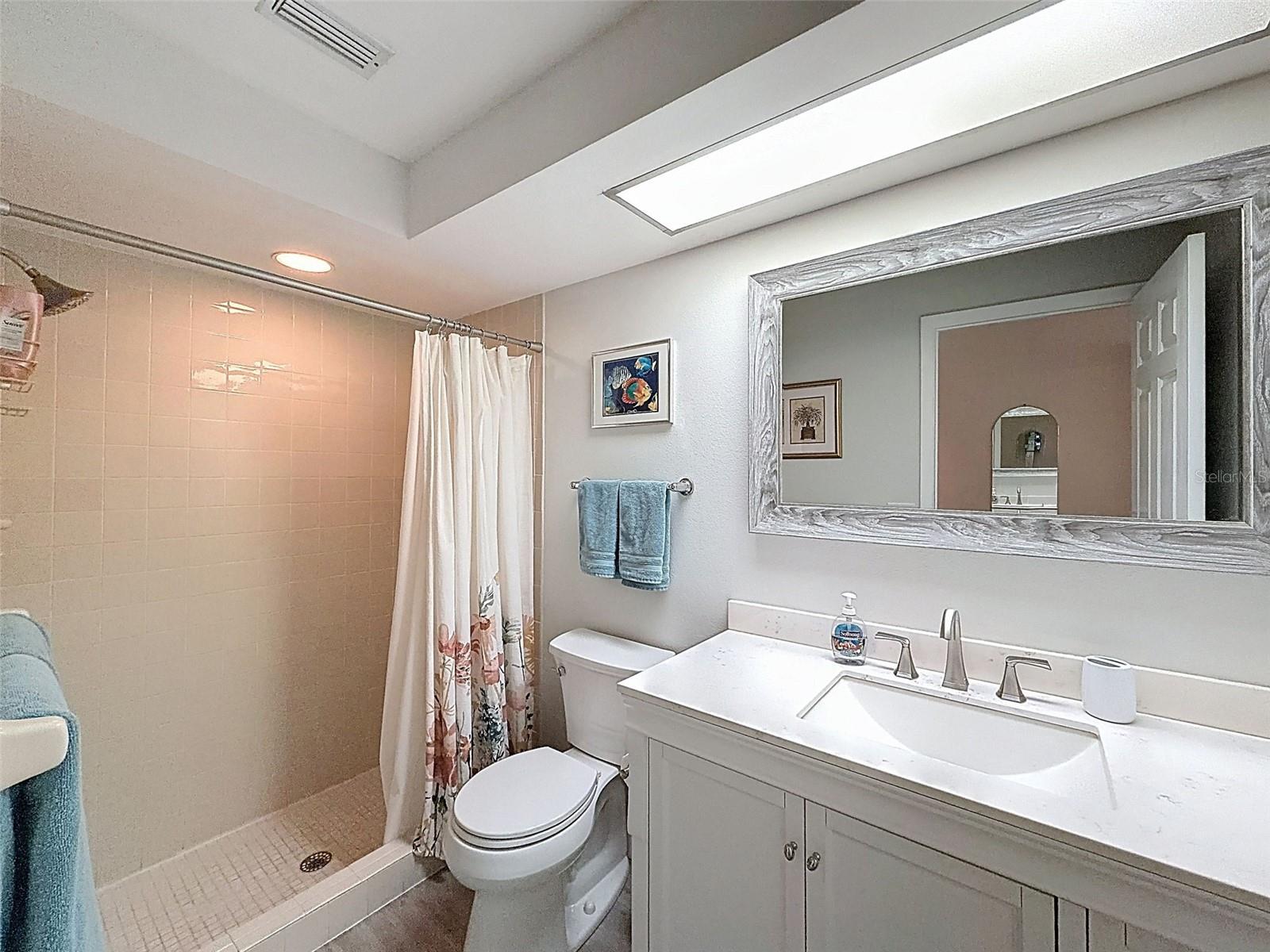 Primary ensuite bath with walk-in shower