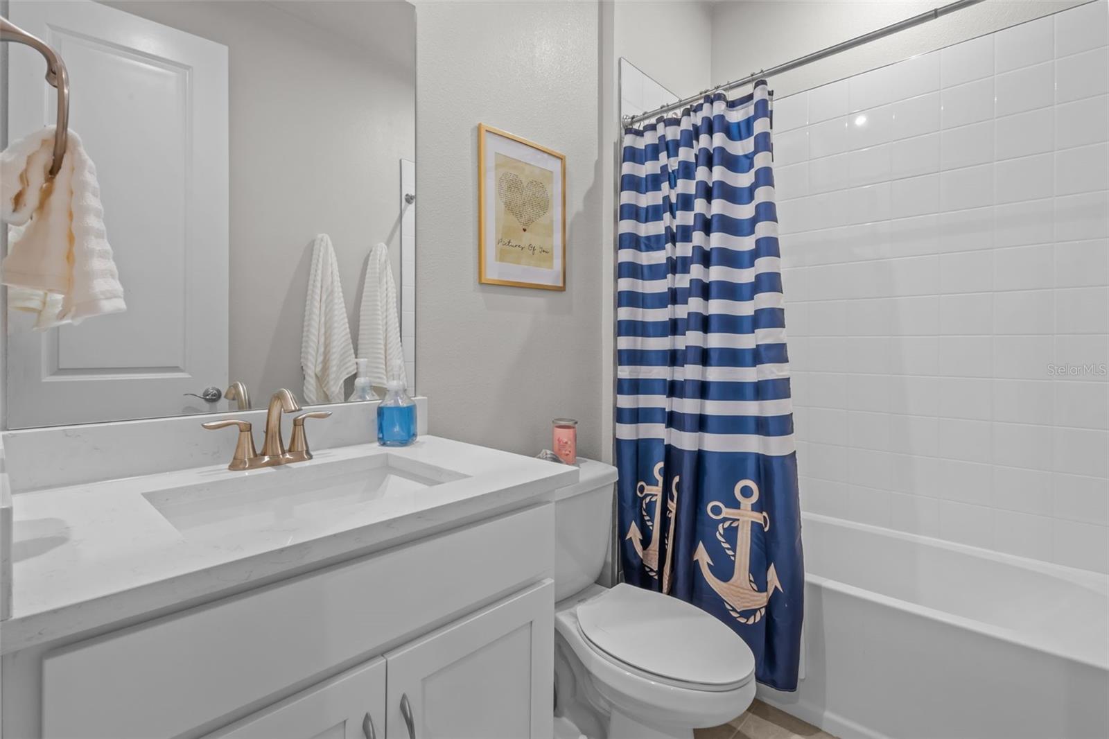 Full bathroom conveniently located for secondary bedrooms and guests.