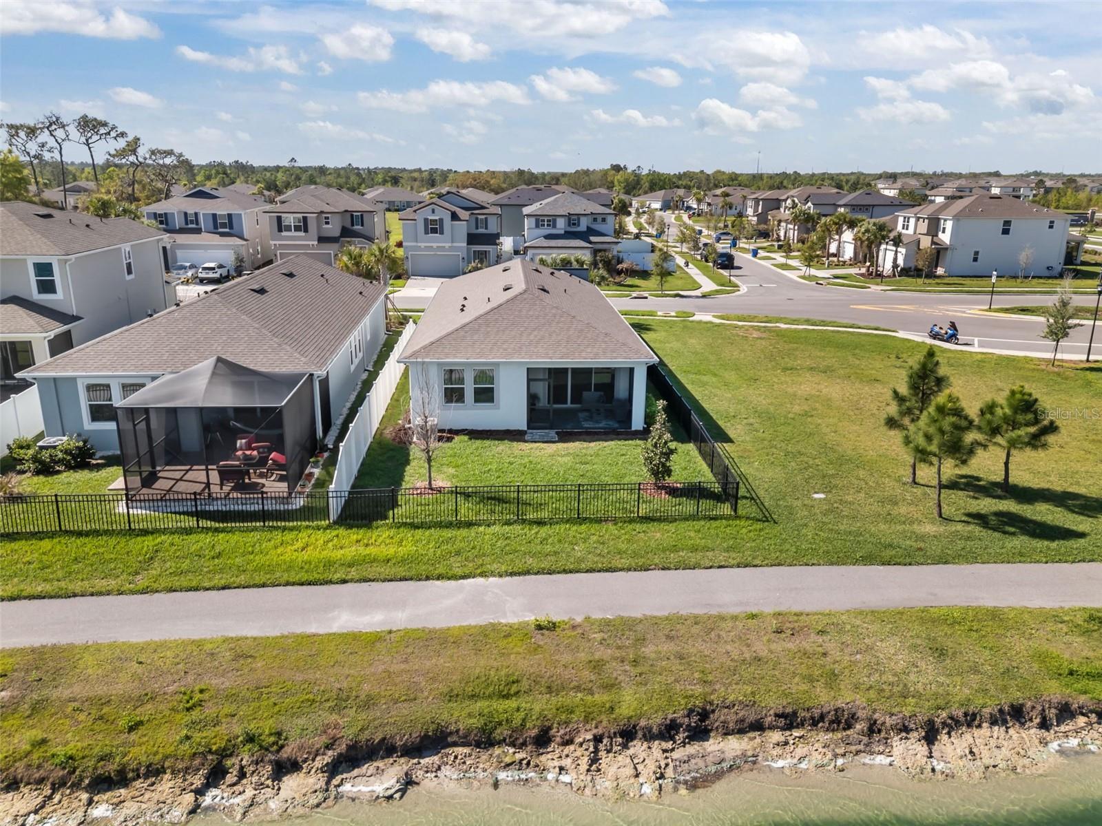 Fully fenced backyard offering privacy and room to enjoy the outdoors.