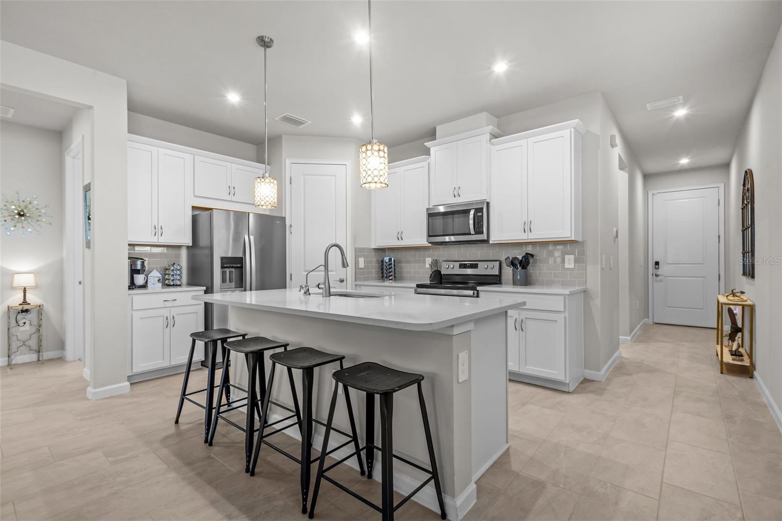 Bright and open kitchen that flows seamlessly into the dining and living areas.