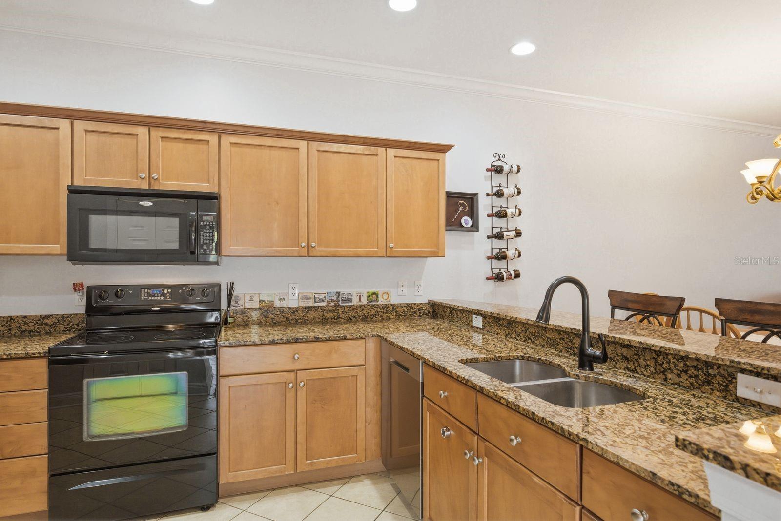 Kitchen with wood cabinets and granite counters
