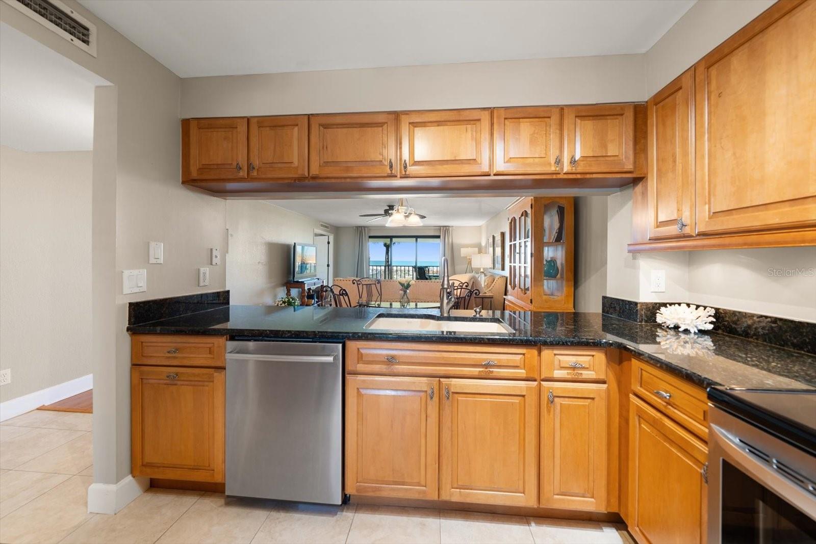 A view from the kitchen pass through to the dining area