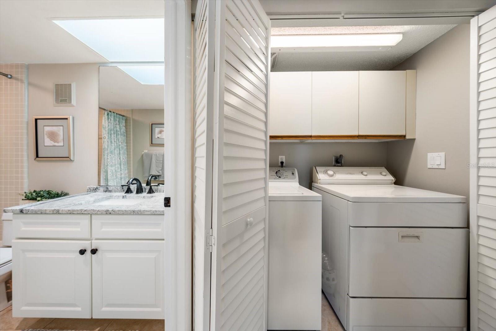 Full sized in unit washer and dryer, a peek at the seond bath